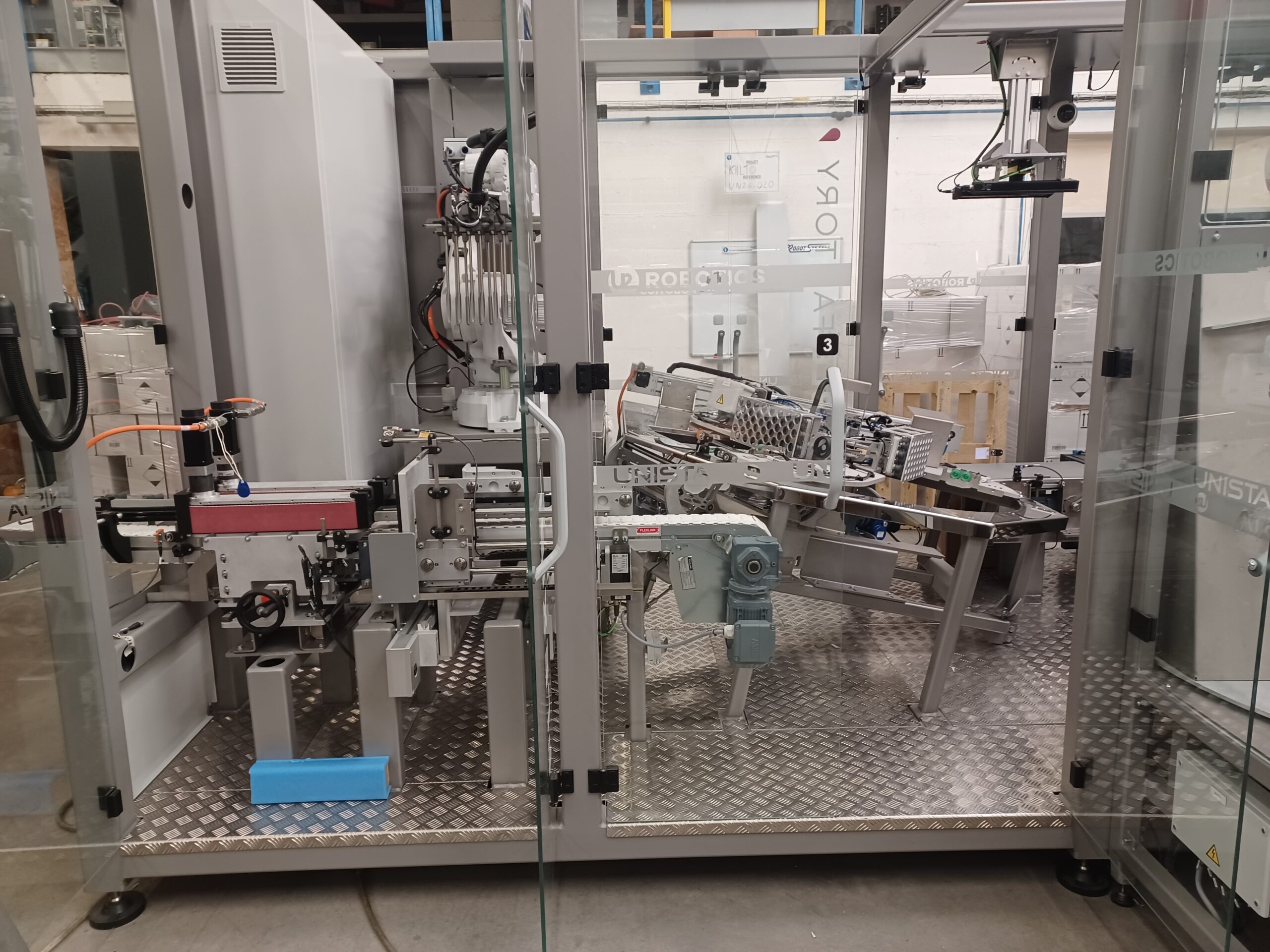 Cellule robotisée d&rsquo;encaissage et de palettisation haute flexibilité